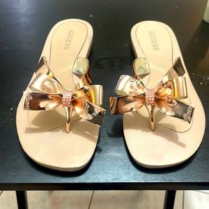 Brand new never worn Guess flip flops comes with original box!